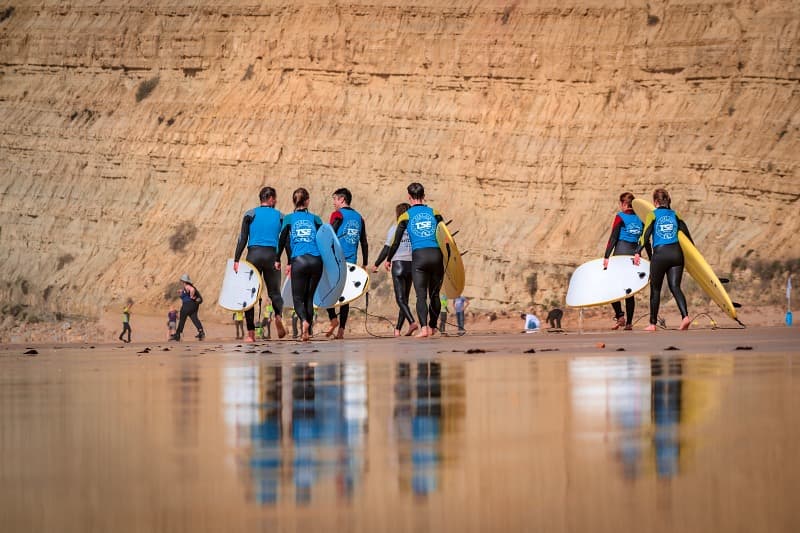 Students preparing for a surf lesson in Lagos