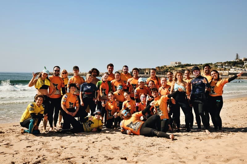 Beginner surfer learning to stand up on the board